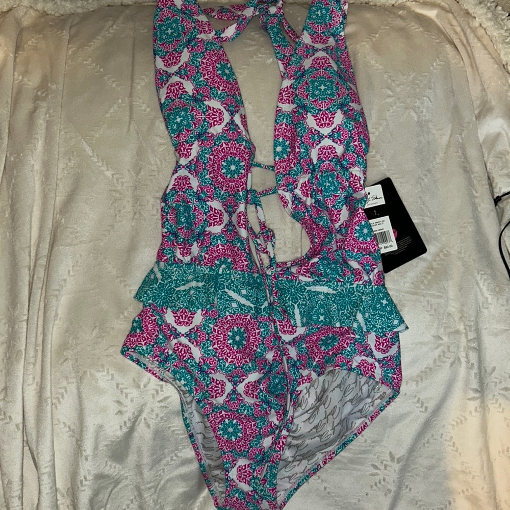 Marilyn Monroe one piece swimsuit. Tag says XL but it is more like a large.